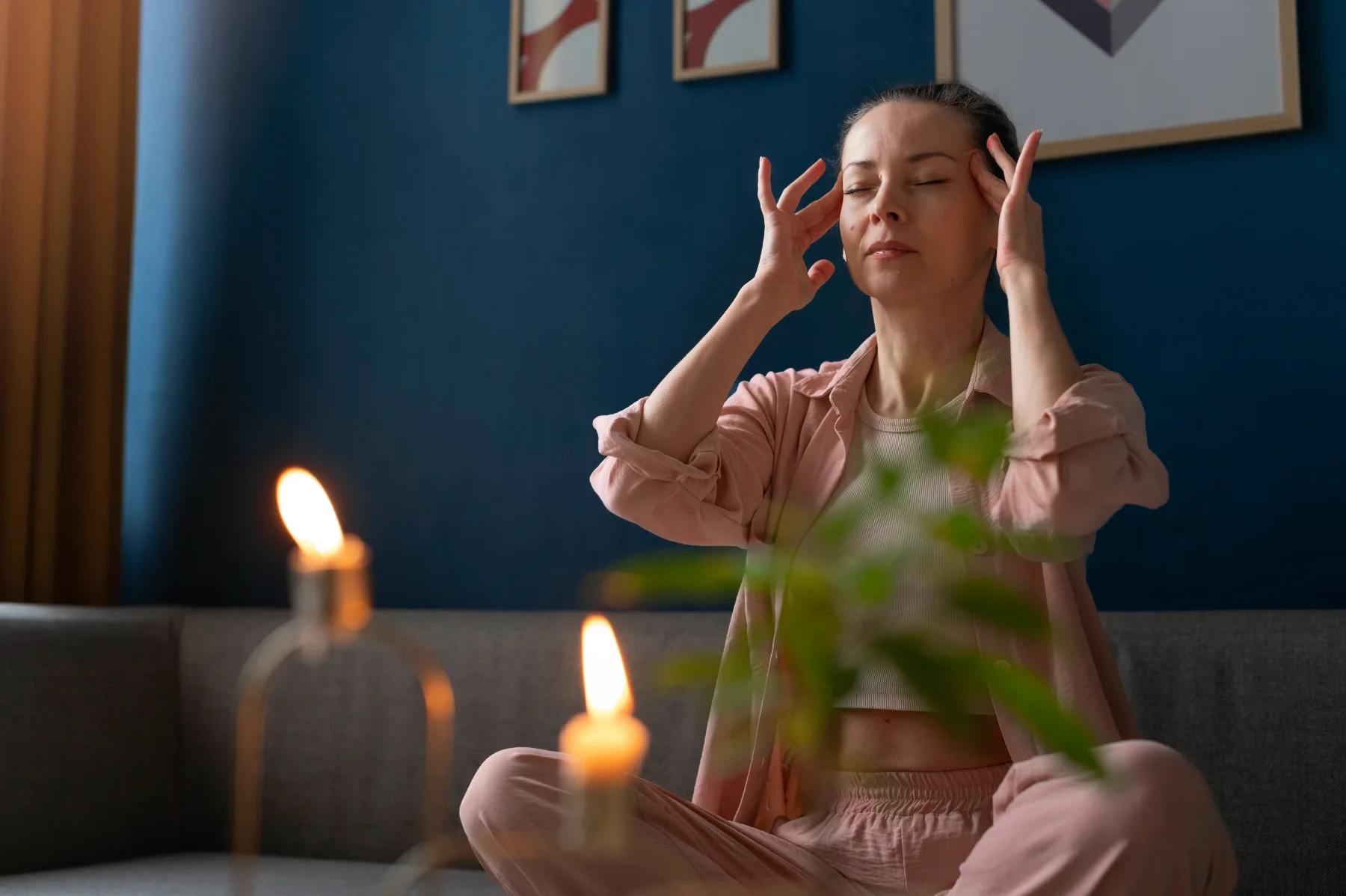 A person sitting calmly with eyes closed, illustrating the settled, focused attention used in hypnotherapy sessions